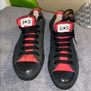 Red and black low top Converse tennies